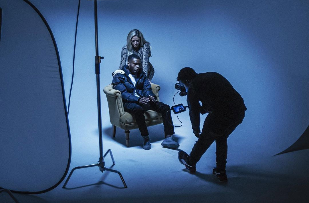 Models being photographed in the infinity cove